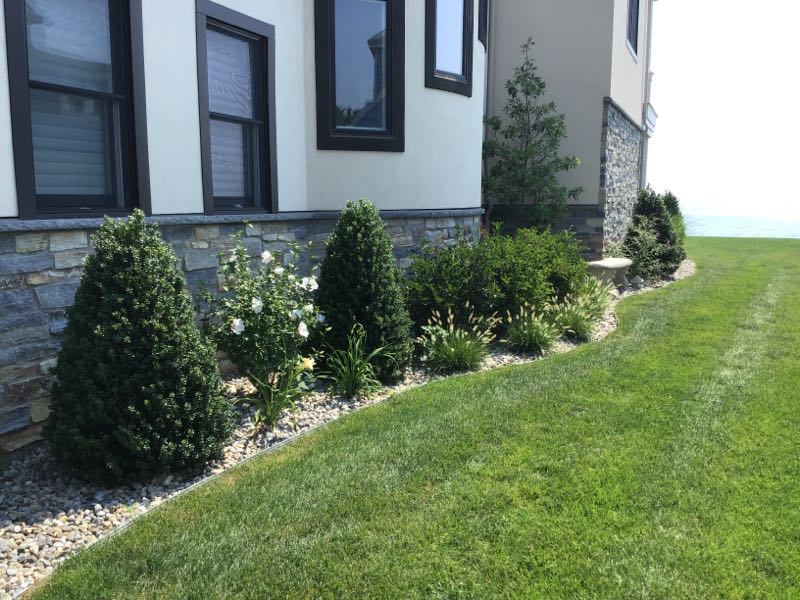 Beach-Inspired Landscape Design with River Rock in Milford Thumbnail